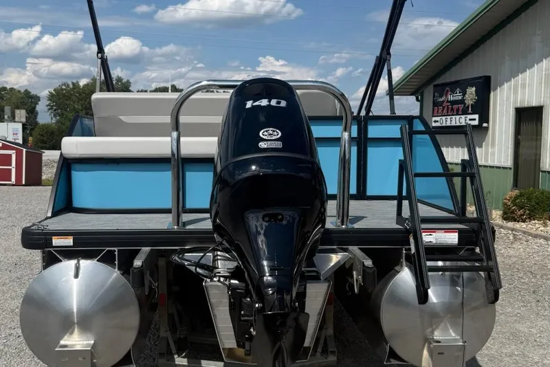 Slide: The Image of 2026 Godfrey Xperience EX2086SFLX pontoon boat with 140 HP engine, rear view. - 2