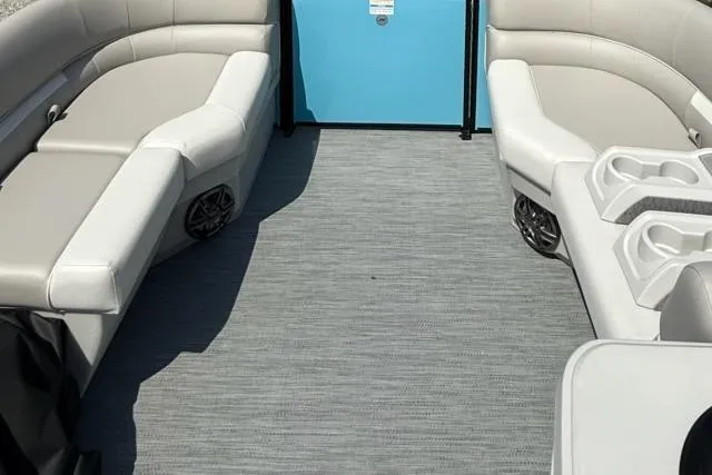 Slide: The Image of Interior of 2026 Godfrey Xperience EX2086SFLX pontoon boat with gray seating and blue door. - 7