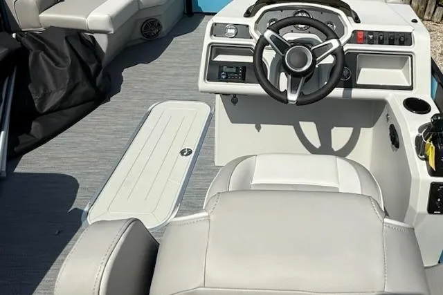 Slide: The Image of 2026 Godfrey Xperience EX2086SFLX boat interior with modern steering and seating. - 8