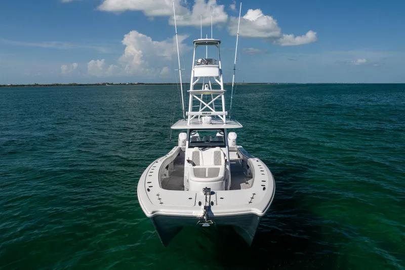 Slide: The Image of 2024 Freeman 43 boat on open water under blue sky. - 10