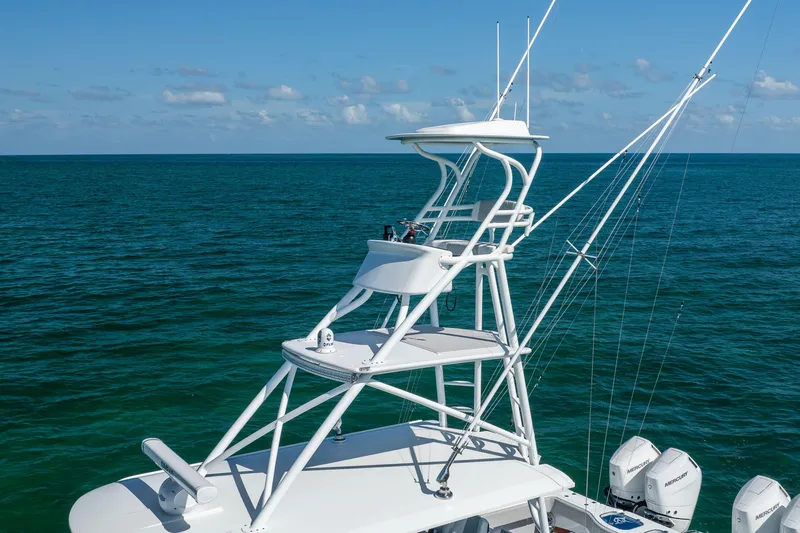 Slide: The Image of 2024 Freeman 43 boat with tower against ocean backdrop. - 13