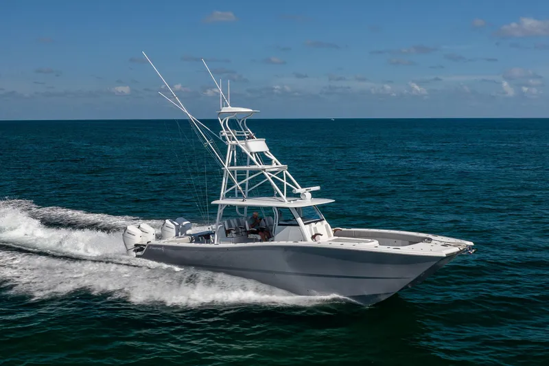 Slide: The Image of 2024 Freeman 43 boat cruising on open ocean under clear blue sky. - 19