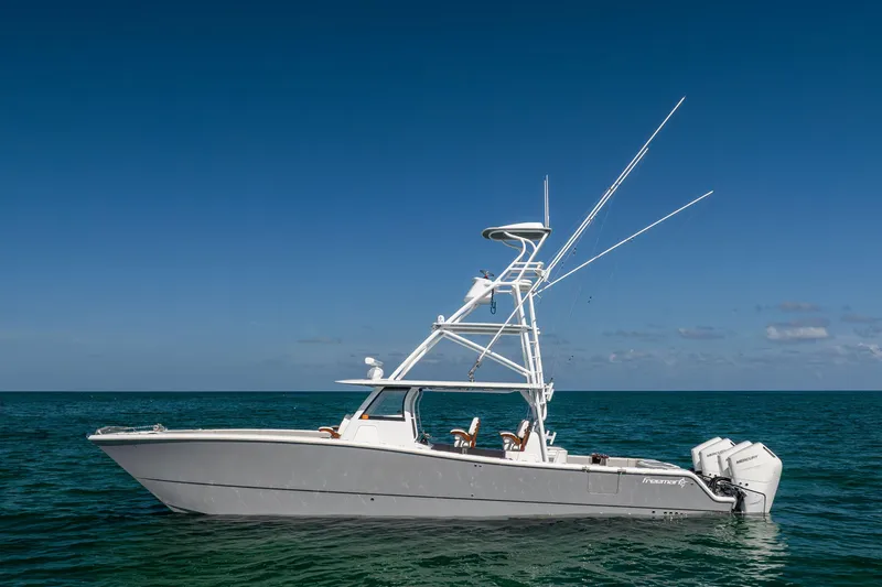 Slide: The Image of 2024 Freeman 43 boat on open sea under clear blue sky. - 2