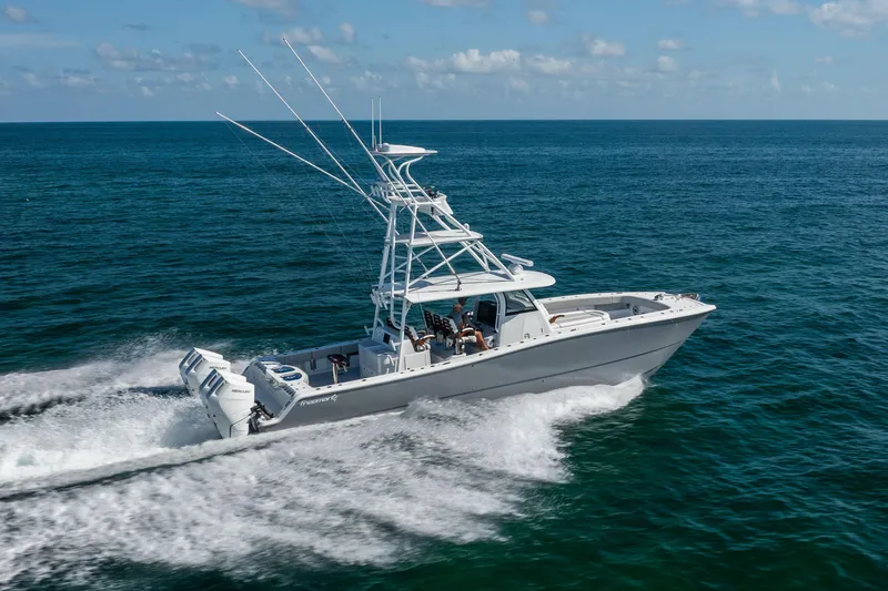 Slide: The Image of 2024 Freeman 43 boat cruising on open ocean under clear skies. - 20