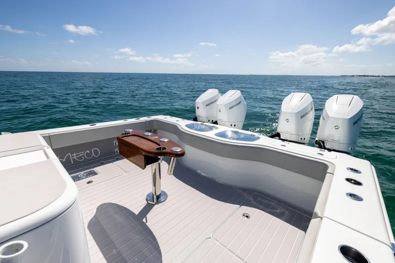 Slide: The Image of 2024 Freeman 43 boat with four engines, spacious deck, and ocean view. - 26