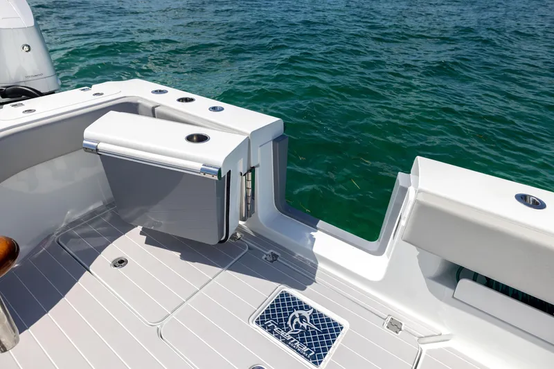 Slide: The Image of 2024 Freeman 43 boat deck with seating, cup holder, and ocean view. - 28