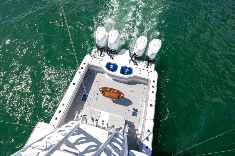 Slide: The Image of Aerial view of 2024 Freeman 43 boat with four engines on open water. - 33