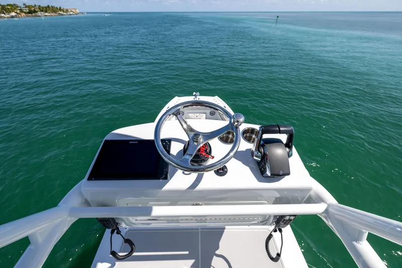 Slide: The Image of Helm of 2024 Freeman 43 boat with ocean view and navigation controls. - 34