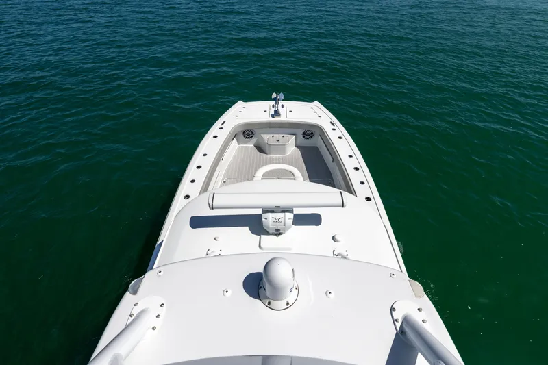 Slide: The Image of 2024 Freeman 43 boat on calm water, showcasing sleek design and spacious deck. - 35