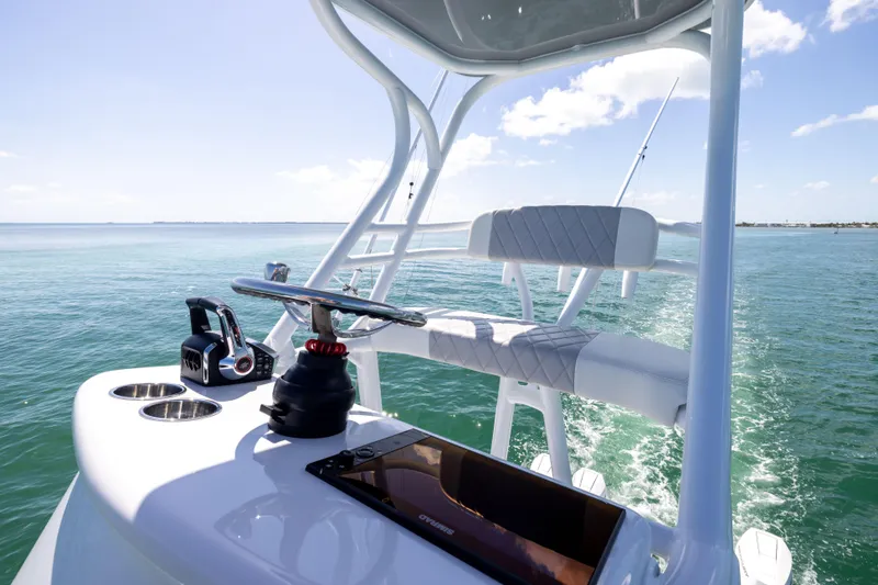 Slide: The Image of 2024 Freeman 43 boat helm with modern controls and ocean view. - 36