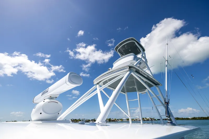 Slide: The Image of 2024 Freeman 43 boat with radar and tower against a clear blue sky. - 39