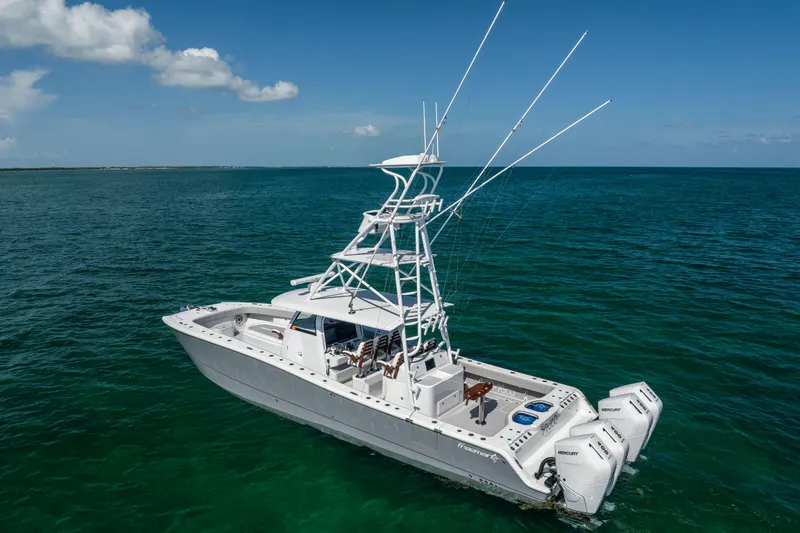 Slide: The Image of 2024 Freeman 43 boat on open sea with clear blue skies. - 4