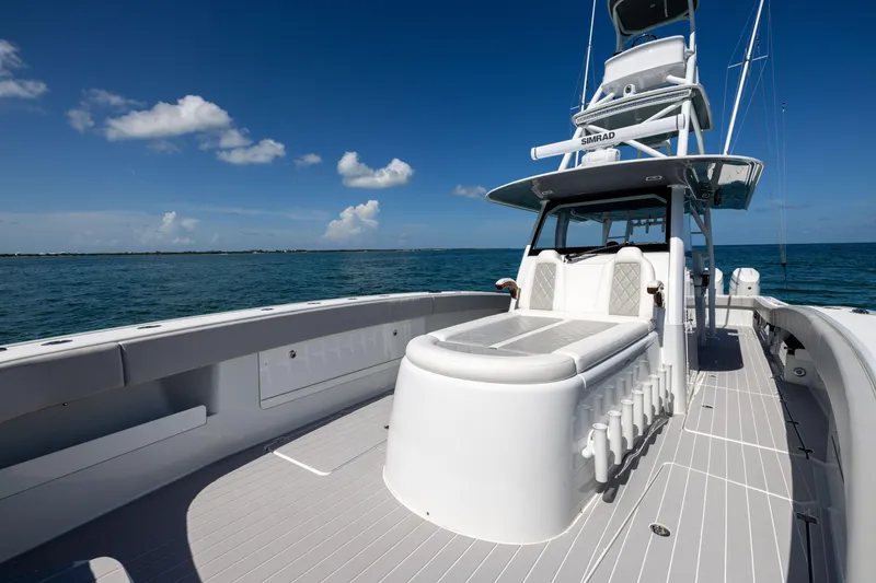 Slide: The Image of 2024 Freeman 43 boat on open water, featuring sleek design and spacious deck. - 56