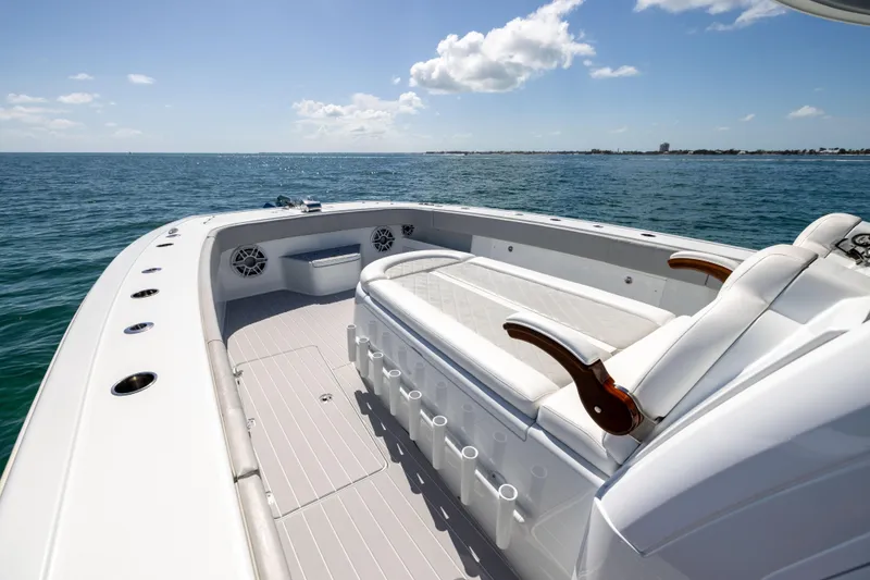 Slide: The Image of Luxurious 2024 Freeman 43 boat interior with seating, ocean view, and clear sky. - 58