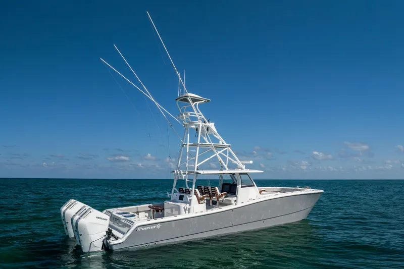 Slide: The Image of 2024 Freeman 43 boat on open sea with clear blue sky. - 6