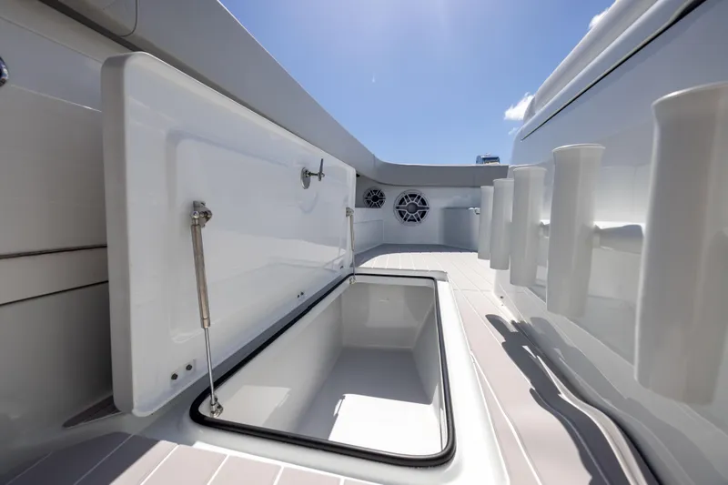 Slide: The Image of Open storage compartment on 2024 Freeman 43 boat under clear blue sky. - 63