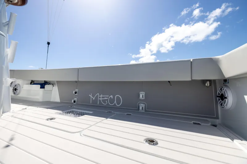 Slide: The Image of 2024 Freeman 43 boat deck under clear blue sky, featuring modern design and speakers. - 66