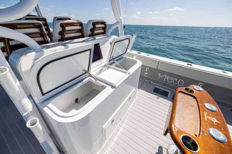 Slide: The Image of 2024 Freeman 43 boat deck with open storage compartments and ocean view. - 68
