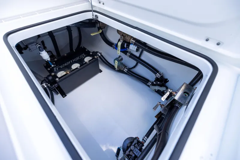 Slide: The Image of 2024 Freeman 43 boat compartment with advanced plumbing and wiring system. - 72