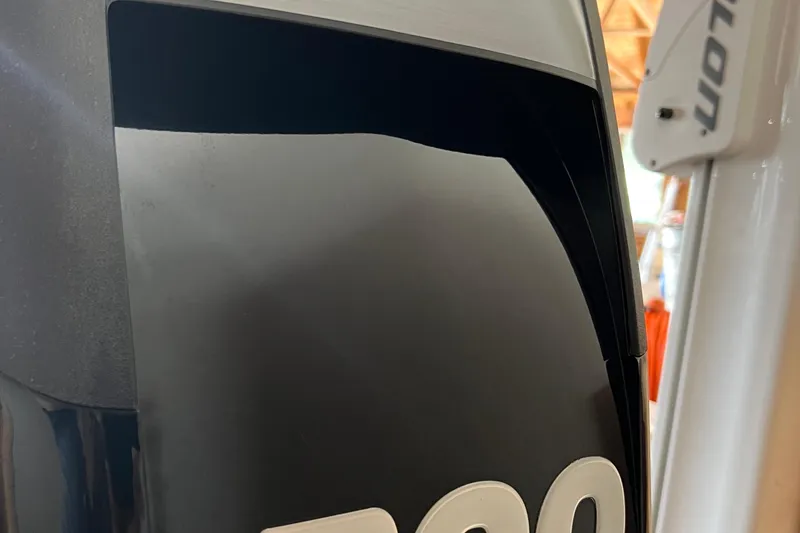 Slide: The Image of Close-up of a 2016 Lund 1875 Pro-V Bass XS boat engine detail. - 2