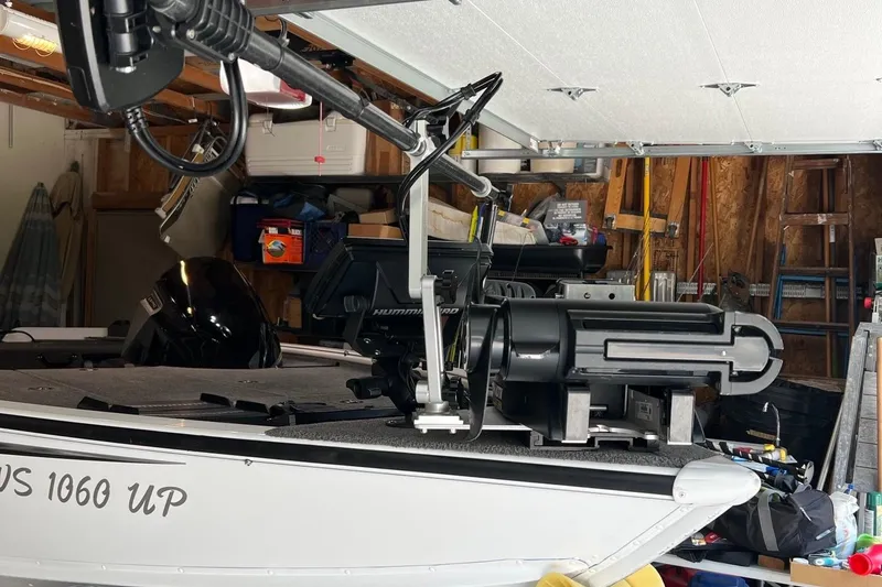 Slide: The Image of 2016 Lund 1875 Pro-V Bass XS boat in garage with mounted equipment. - 4