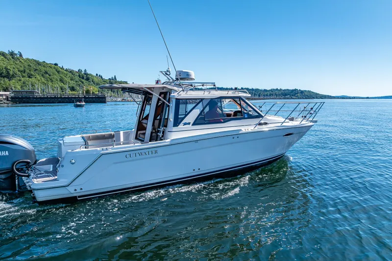 Slide: The Image of 2024 Cutwater C-248 Coupe cruising on a sunny day in scenic waters. - 14