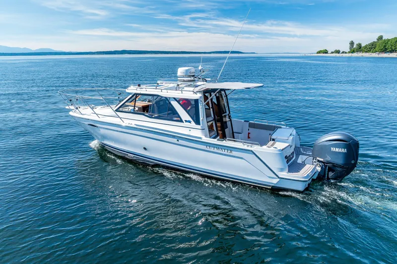 Slide: The Image of 2024 Cutwater C-248 Coupe cruising on open water, featuring Yamaha outboard engine. - 3