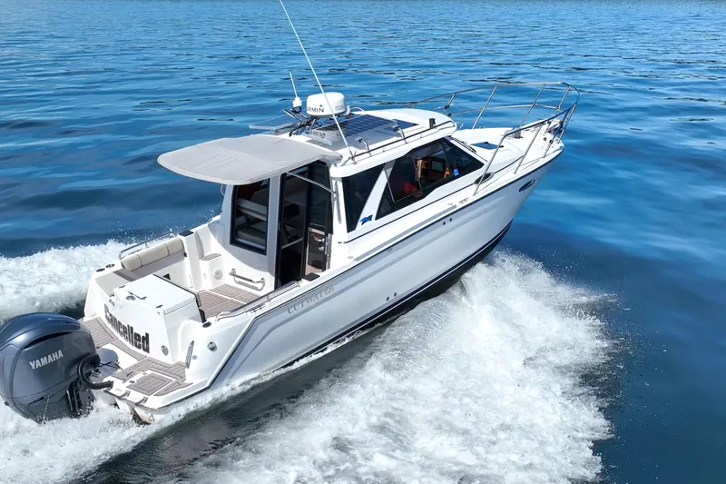 Slide: The Image of 2024 Cutwater C-248 Coupe cruising on open water, showcasing sleek design and Yamaha engine. - 7