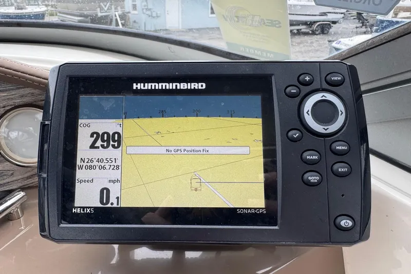 Slide: The Image of Humminbird GPS display on 2015 Stingray 215 LR boat, showing coordinates and speed. - 13
