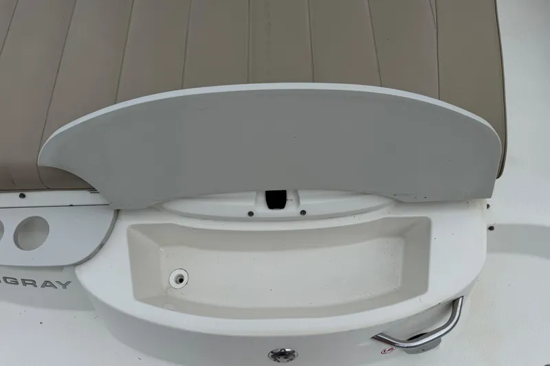 Slide: The Image of 2015 Stingray 215 LR boat stern with seating and storage compartment. - 37