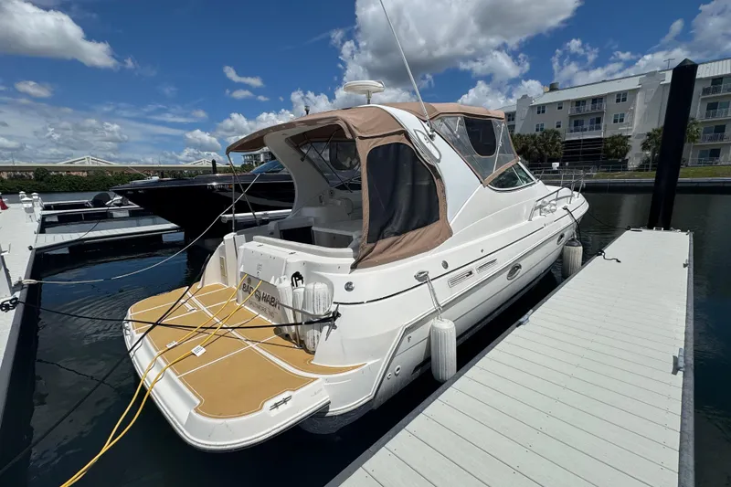 Slide: The Image of 2003 Cruisers Yachts 3372 Express interior with seating and table, showcasing luxury design. - 12