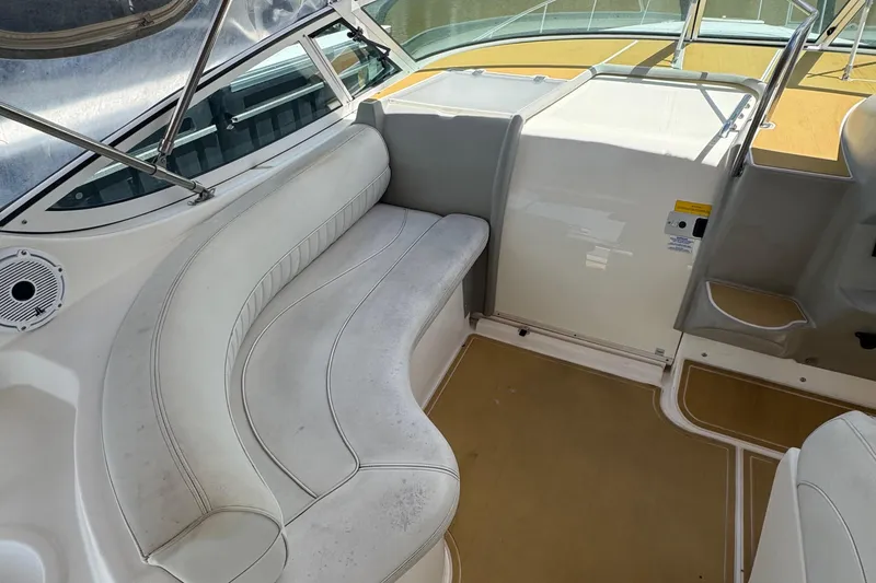 Slide: The Image of 2003 Cruisers Yachts 3372 Express boat cruising on a calm waterway. - 6