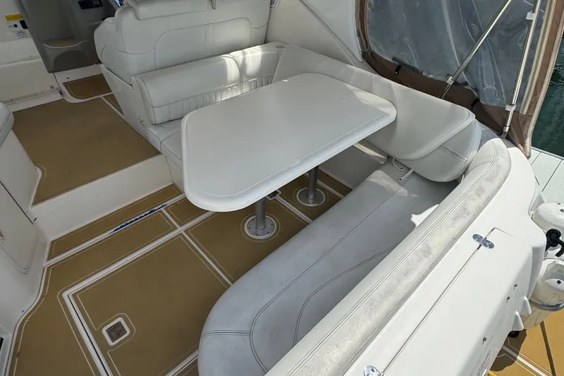 Slide: The Image of 2003 Cruisers Yachts 3372 Express on water, rear view, clear sky. - 7