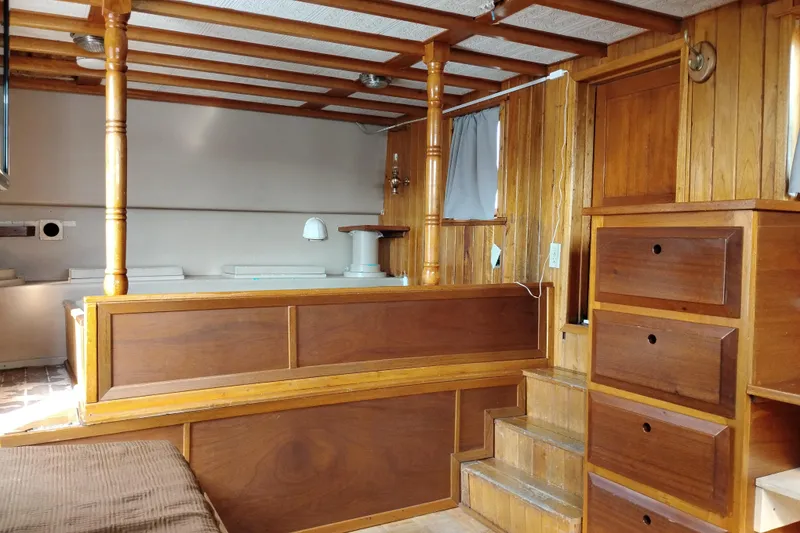 Slide: The Image of Interior of 1983 Custom Entienne Francois 50 Pilothouse with wooden furnishings and cozy design. - 11