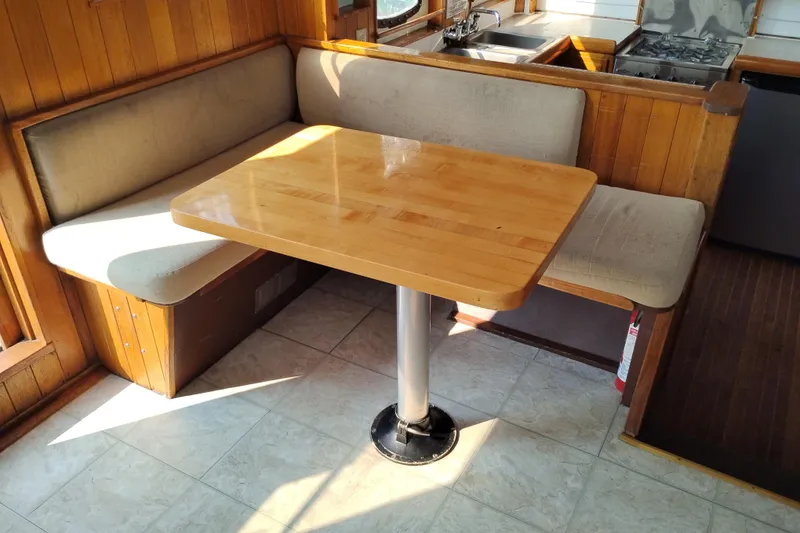Slide: The Image of Cozy dining area in 1983 Custom Entienne Francois 50 Pilothouse yacht. - 16