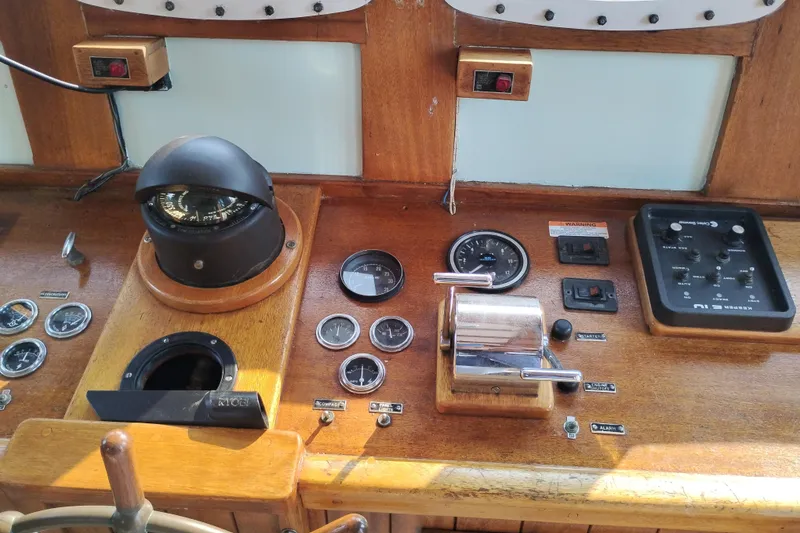 Slide: The Image of Vintage 1983 Custom Entienne Francois 50 Pilothouse helm with compass and control panel. - 18