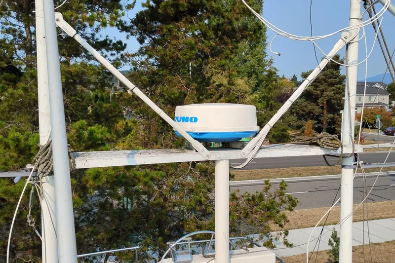 Slide: The Image of Radar equipment on 1983 Custom Entienne Francois 50 Pilothouse, surrounded by trees and road. - 2