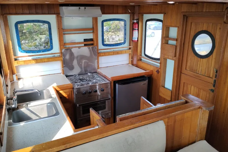 Slide: The Image of Interior of 1983 Custom Entienne Francois 50 Pilothouse with kitchen and wooden accents. - 27