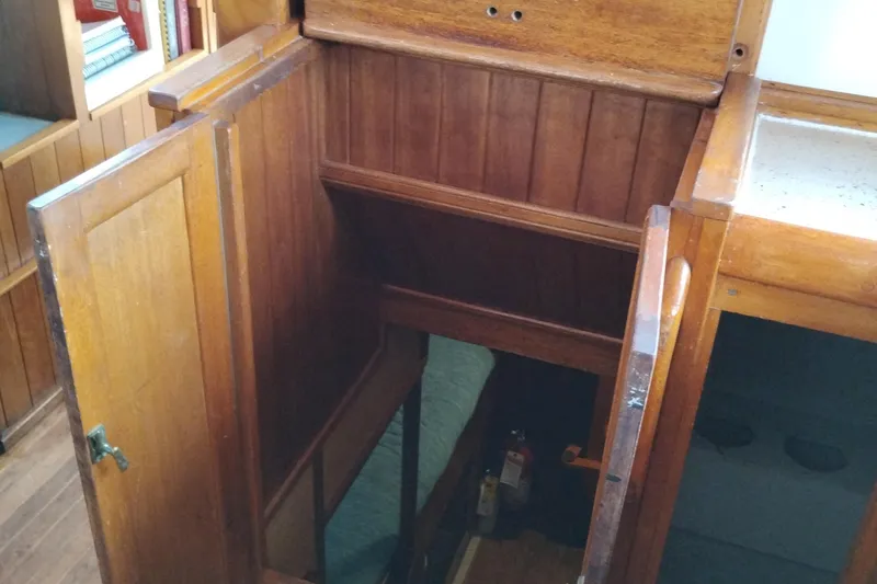 Slide: The Image of Interior of 1983 Custom Entienne Francois 50 Pilothouse with wooden cabinetry and stairs. - 28