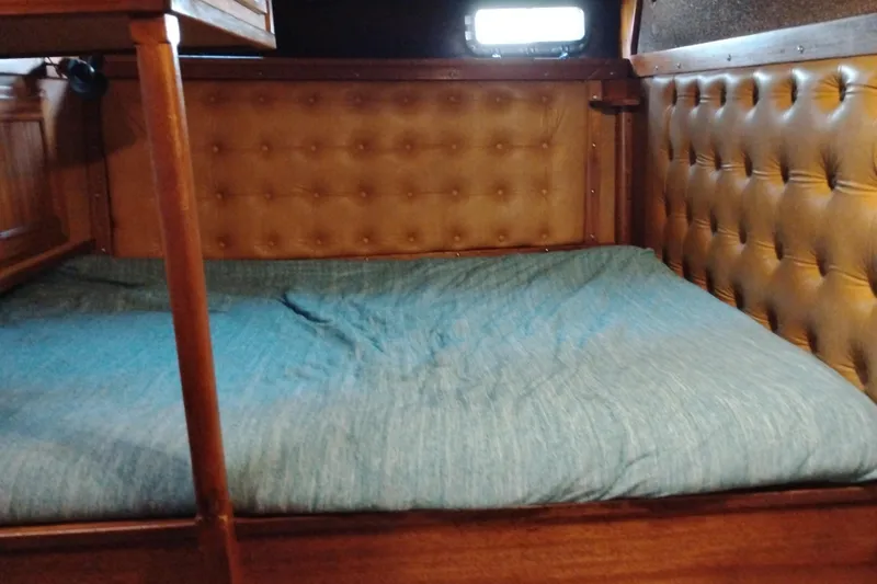Slide: The Image of Cozy cabin bed with tufted leather walls in 1983 Custom Entienne Francois 50 Pilothouse. - 30
