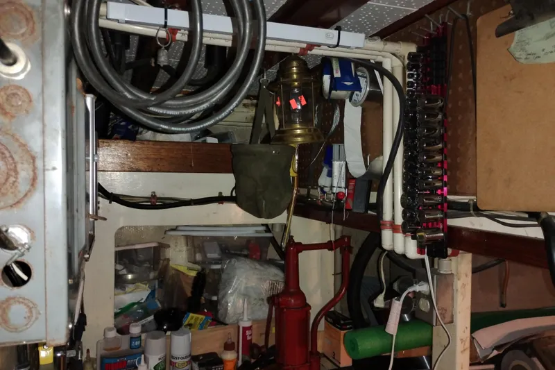 Slide: The Image of Engine room of 1983 Custom Entienne Francois 50 Pilothouse with tools and equipment. - 42