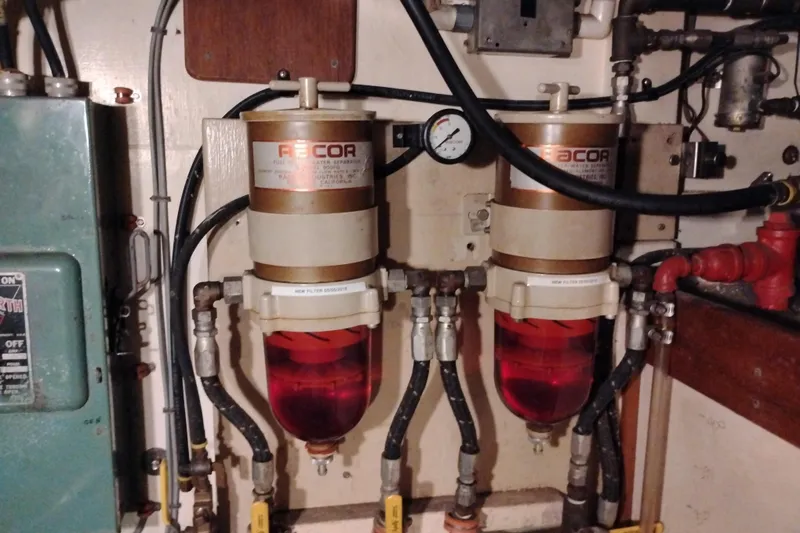 Slide: The Image of Fuel filter system in 1983 Custom Entienne Francois 50 Pilothouse engine room. - 44