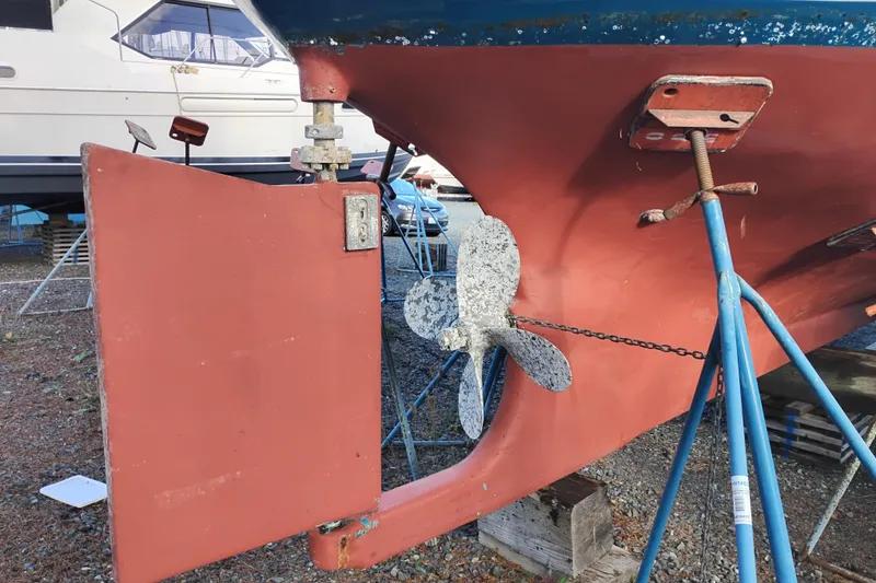 Slide: The Image of 1983 Custom Entienne Francois 50 Pilothouse boat propeller and rudder in dry dock. - 50