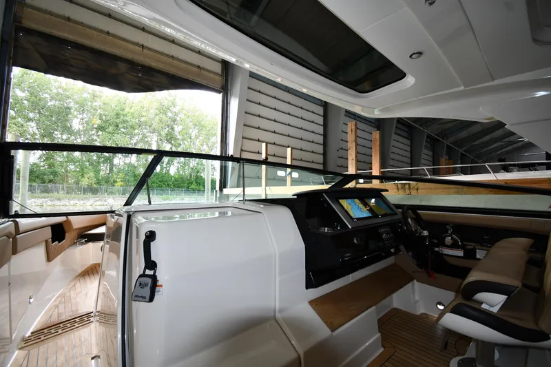 Slide: The Image of Interior view of 2020 Sea Ray SLX 400 Outboard boat, featuring modern helm and seating. - 11