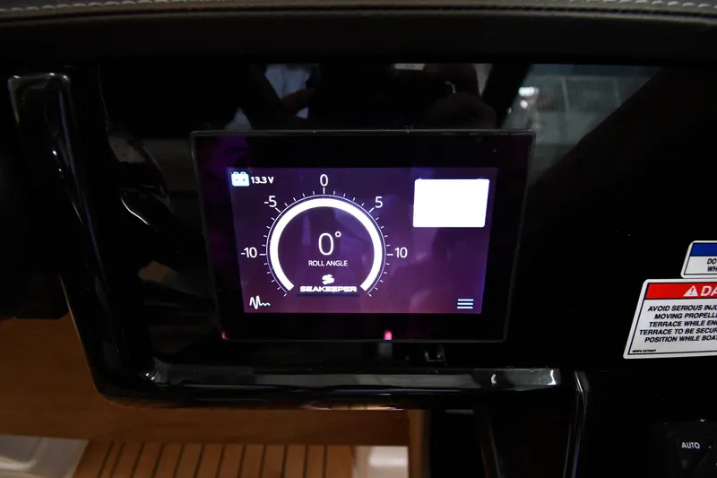 Slide: The Image of Digital display on 2020 Sea Ray SLX 400 Outboard showing roll angle and voltage. - 15