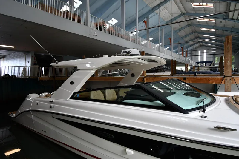 Slide: The Image of 2020 Sea Ray SLX 400 Outboard in indoor marina setting. - 3