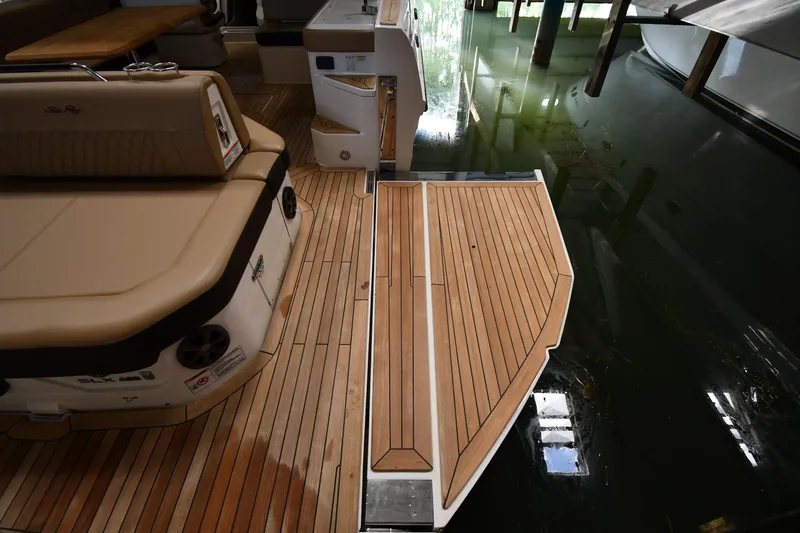 Slide: The Image of 2020 Sea Ray SLX 400 Outboard with teak deck, docked in a marina. - 30