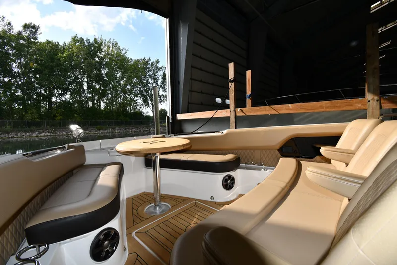 Slide: The Image of Luxurious interior of 2020 Sea Ray SLX 400 Outboard with elegant seating and table. - 33