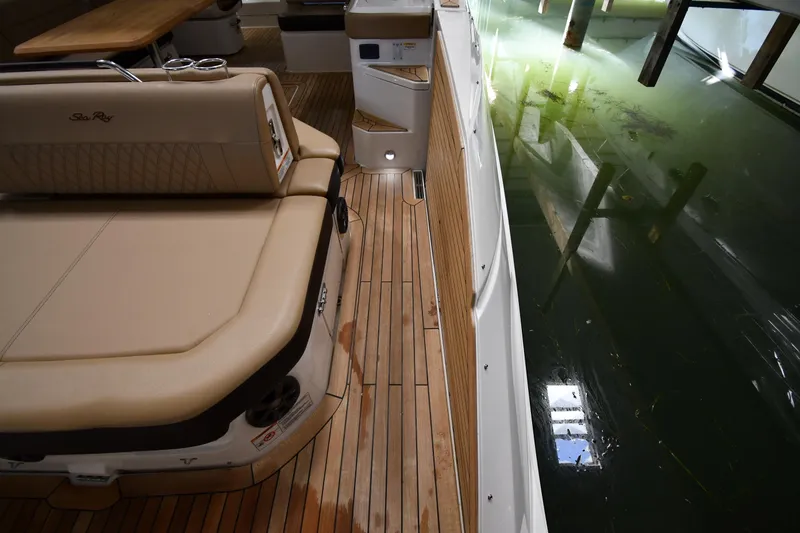 Slide: The Image of 2020 Sea Ray SLX 400 Outboard boat interior with teak flooring and water view. - 43