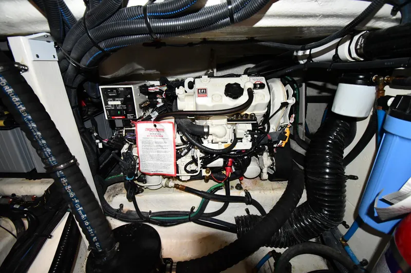Slide: The Image of Engine compartment of 2020 Sea Ray SLX 400 Outboard, showcasing wiring and components. - 46